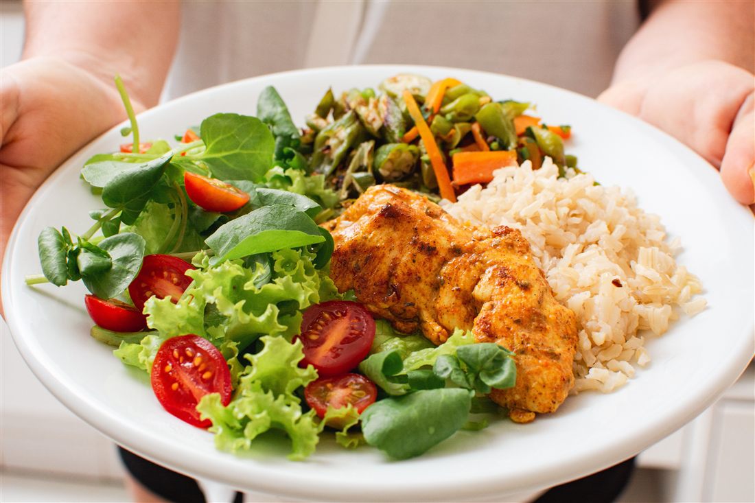 A balanced healthy meal with vegetables, lean protein and grains